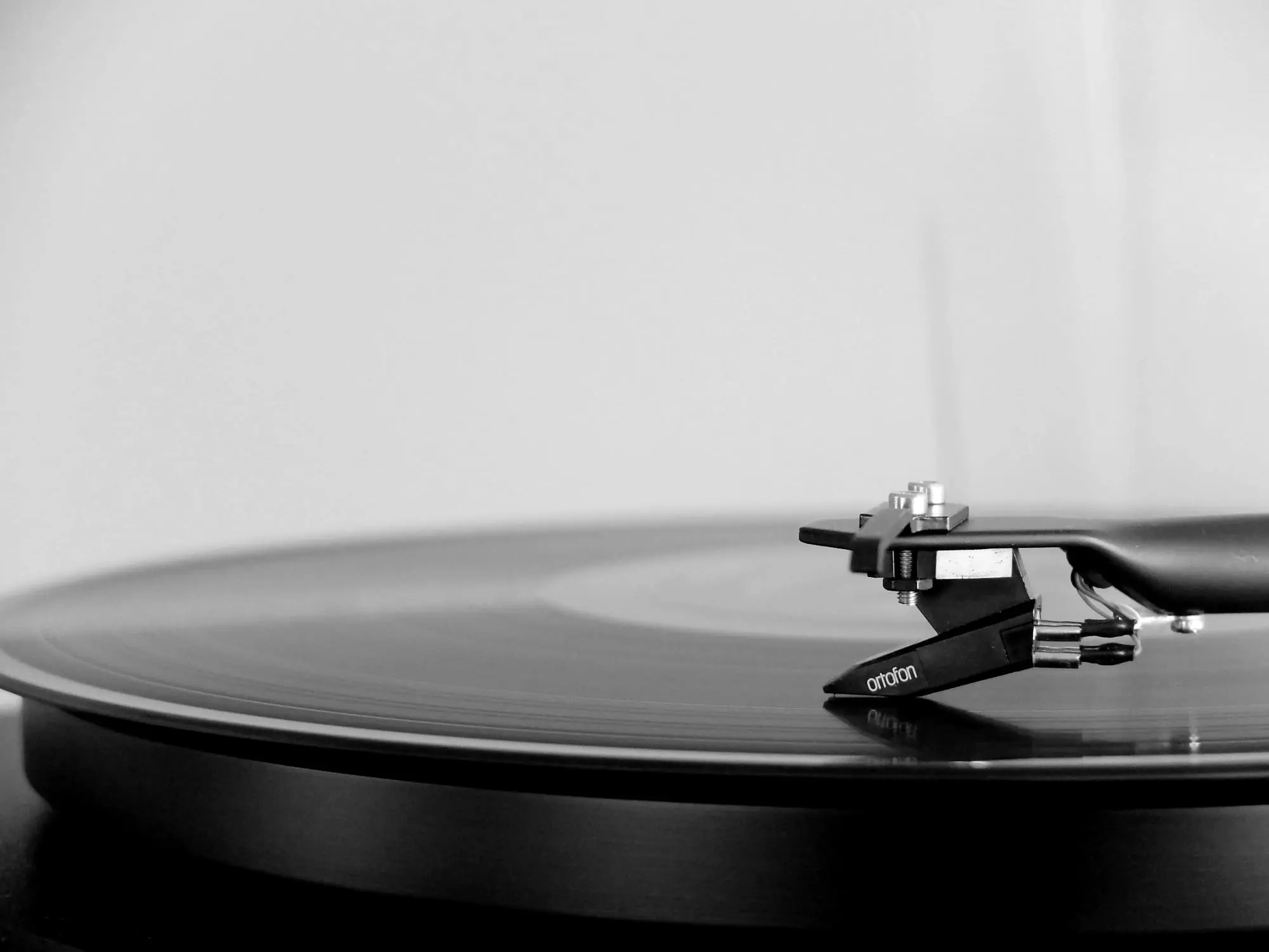 A record spinning on a turntable, stylus on the groove
